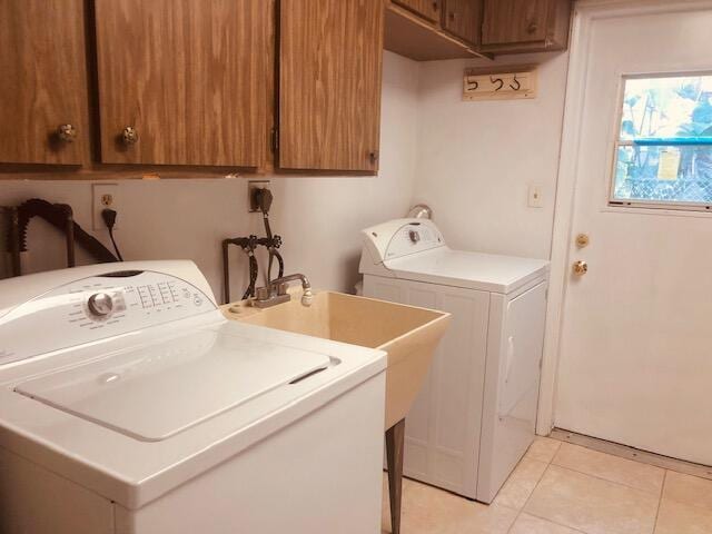 2727-29 NE 30th Ave, Lighthouse Point, FL 33064 - washroom featuring cabinet space, washing machine and clothes dryer, and light tile patterned flooring