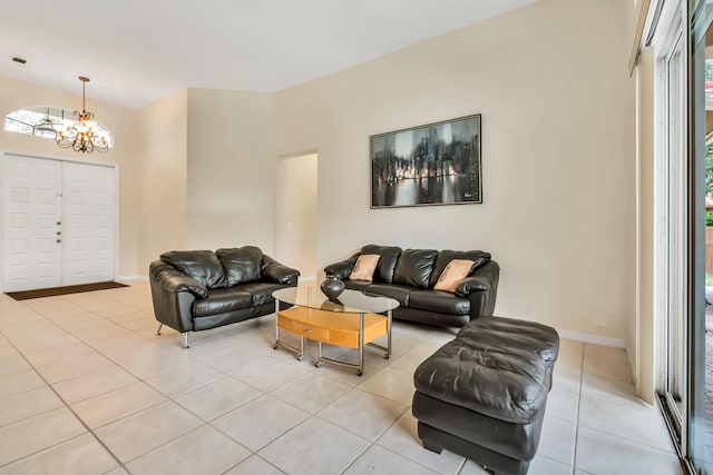 living room with light tile patterned floors and a notable chandelier