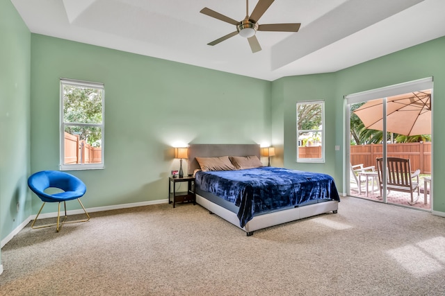 carpeted bedroom featuring ceiling fan, access to exterior, and multiple windows