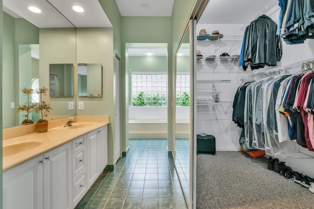 bathroom with tile patterned floors and vanity