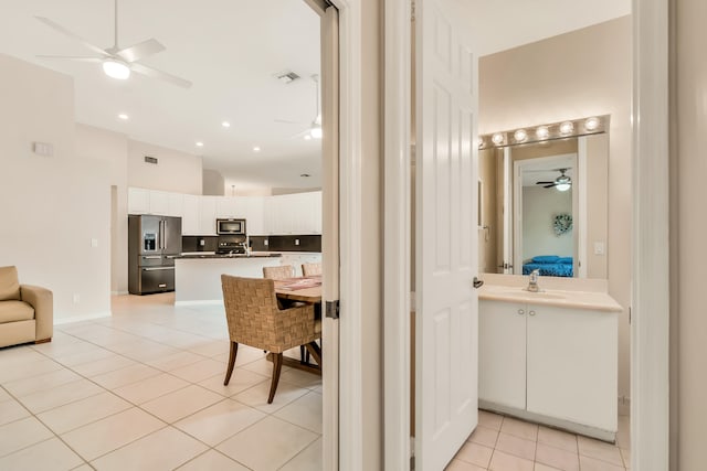 bathroom featuring tile patterned flooring and sink