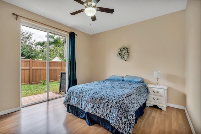 bedroom featuring ceiling fan, access to outside, and light hardwood / wood-style flooring