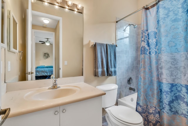 full bathroom with vanity, toilet, ceiling fan, and shower / bath combo with shower curtain