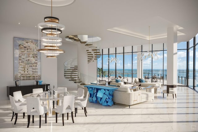 dining area featuring an inviting chandelier, a water view, a wall of windows, and a healthy amount of sunlight