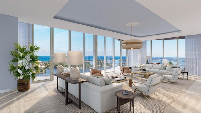 living room featuring light wood-type flooring, a wall of windows, and a water view