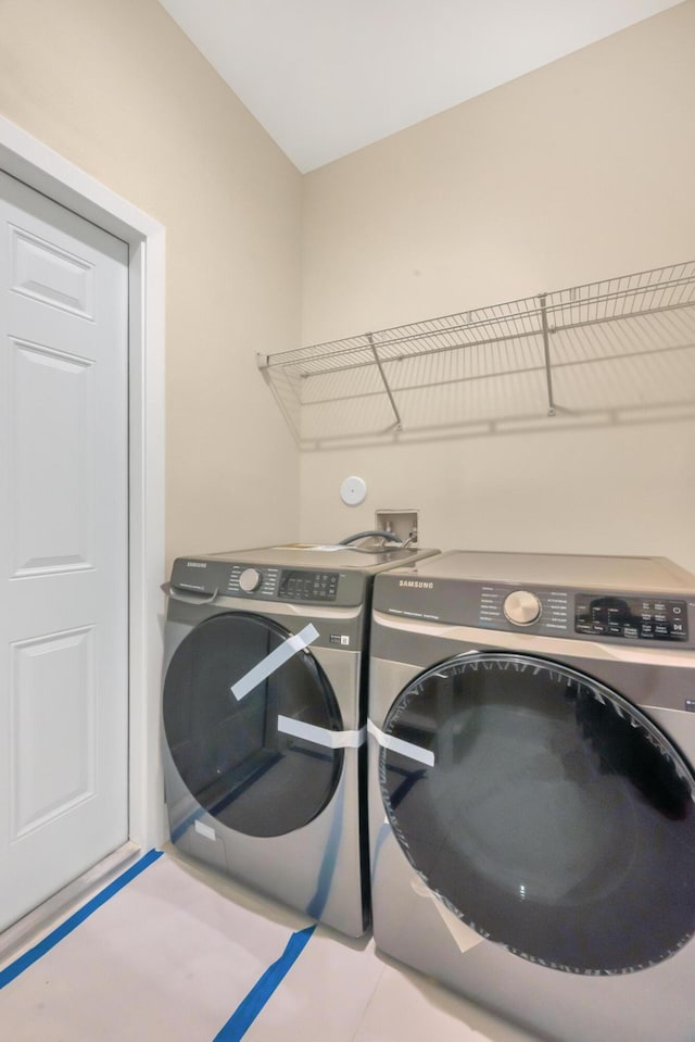 laundry room featuring washing machine and dryer