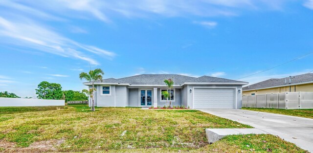 ranch-style house with a front yard and a garage