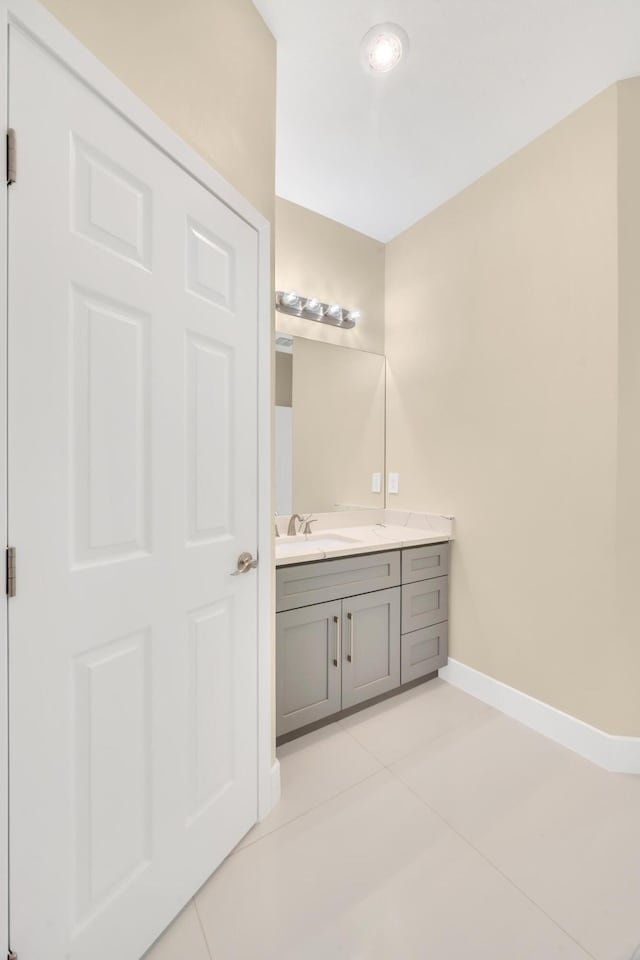 bathroom with vanity and tile patterned flooring