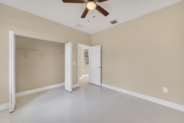 unfurnished bedroom with ceiling fan, a closet, and tile patterned flooring