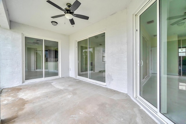 exterior space featuring ceiling fan