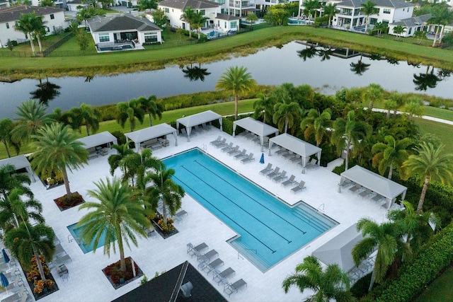 view of pool with a water view