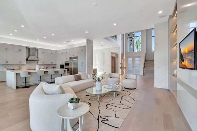 living room with light hardwood / wood-style flooring