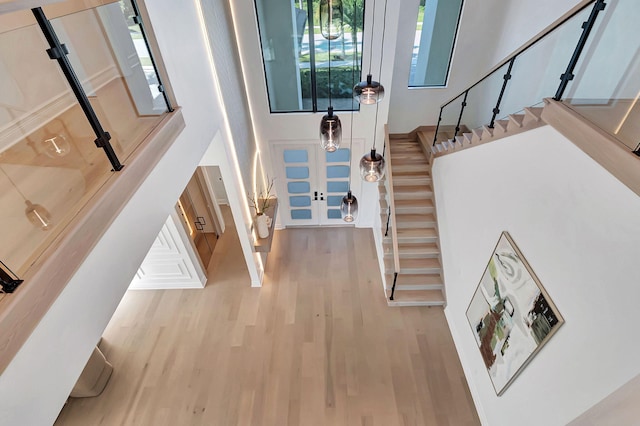 entryway with french doors and light wood-type flooring