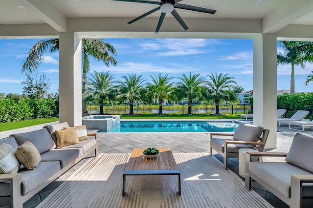 view of pool featuring an in ground hot tub, a patio, and an outdoor hangout area