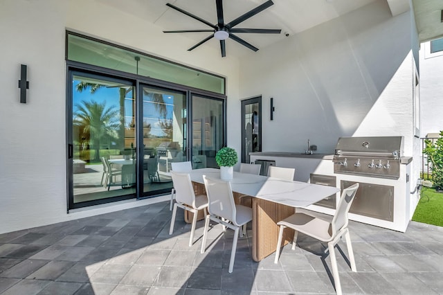 view of patio / terrace with area for grilling, ceiling fan, and sink