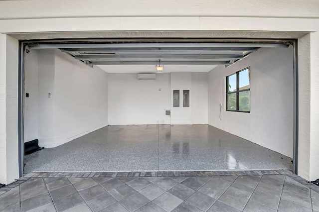 garage with electric panel and an AC wall unit