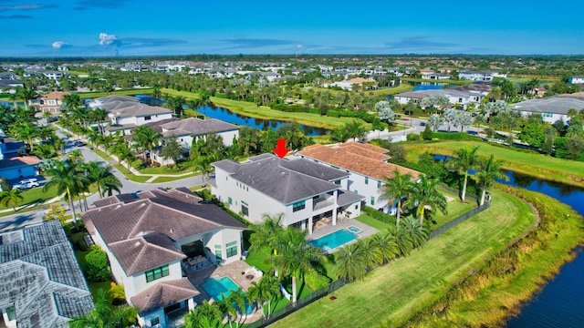 birds eye view of property featuring a water view