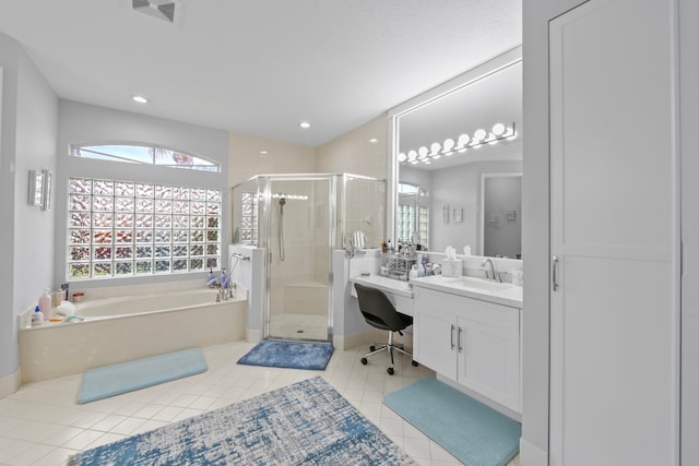 bathroom featuring vanity, separate shower and tub, and tile patterned floors