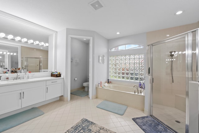 full bathroom featuring tile patterned floors, vanity, toilet, and independent shower and bath