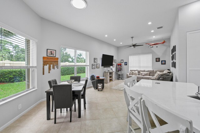 tiled dining room with ceiling fan