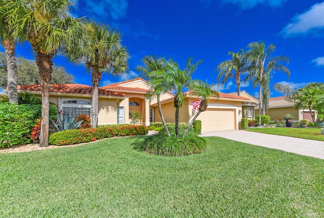 mediterranean / spanish home with a garage and a front yard