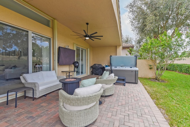 view of patio featuring ceiling fan and a grill