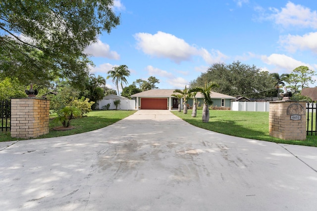 single story home with a front lawn and a garage