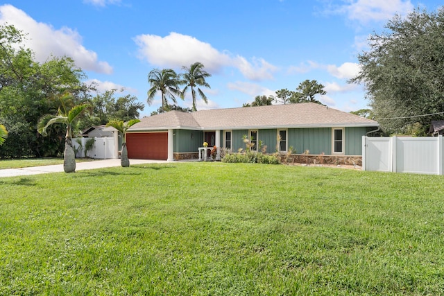 ranch-style house with a front yard and a garage