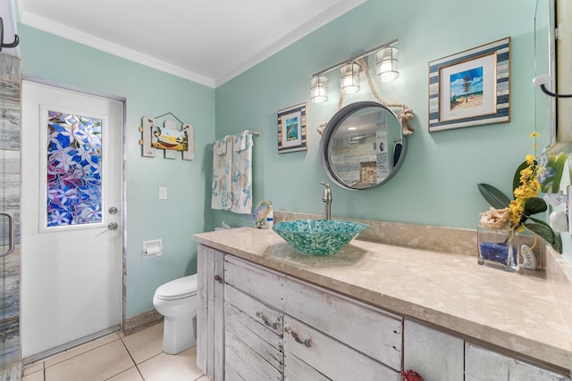 bathroom featuring walk in shower, tile patterned flooring, crown molding, toilet, and vanity