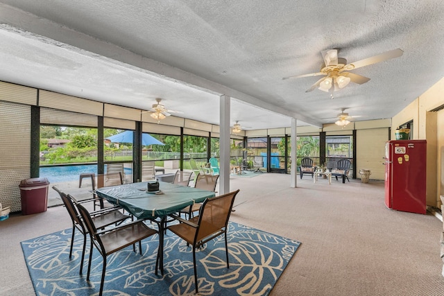 sunroom / solarium featuring a pool and plenty of natural light