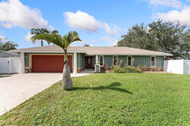 single story home featuring a front yard and a garage