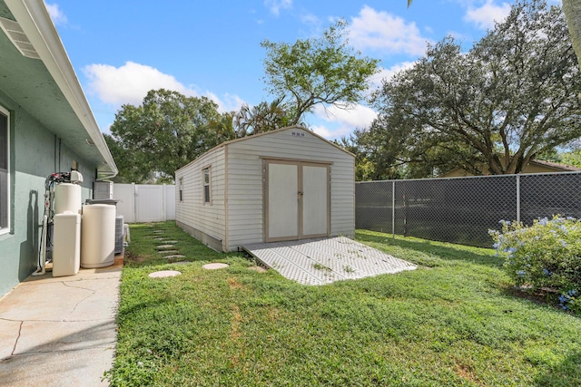 view of outdoor structure featuring a lawn