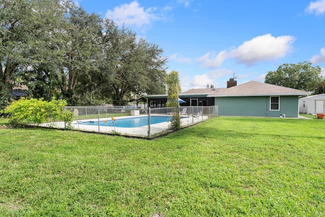 view of swimming pool featuring a yard and a patio