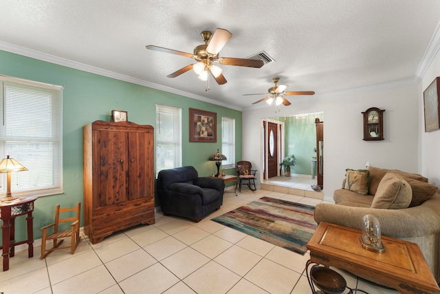 living room featuring ornamental molding, a textured ceiling, and light tile patterned floors