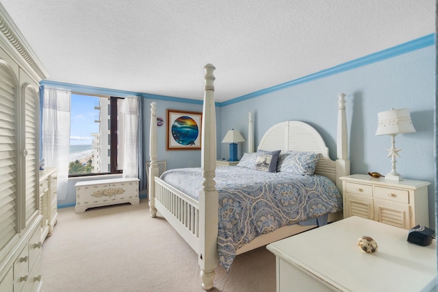 3009 S Ocean Blvd Unit 901, Highland Beach, FL 33487 - bedroom featuring light colored carpet, a textured ceiling, and ornamental molding