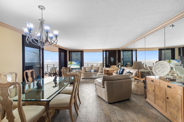 3009 S Ocean Blvd Unit 901, Highland Beach, FL 33487 - dining area with hardwood / wood-style flooring, a chandelier, plenty of natural light, crown molding, and a textured ceiling