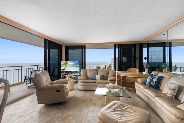 3009 S Ocean Blvd Unit 901, Highland Beach, FL 33487 - living room featuring floor to ceiling windows, hardwood / wood-style floors, and a textured ceiling