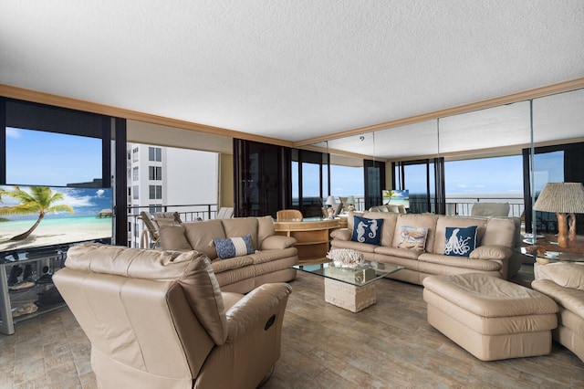 3009 S Ocean Blvd Unit 901, Highland Beach, FL 33487 - living room featuring a wall of windows, a textured ceiling, and wood finished floors