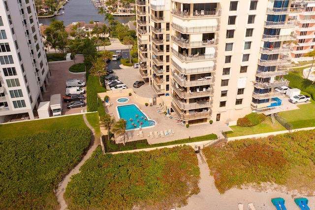 3009 S Ocean Blvd Unit 901, Highland Beach, FL 33487 - drone / aerial view of apartment complex / building, a pool area, and a large body of water