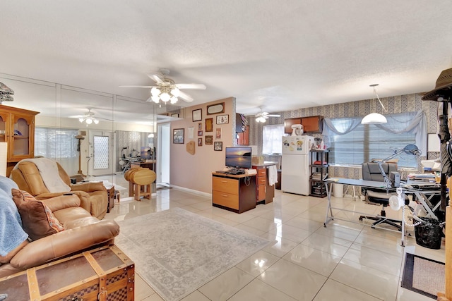 living room with light tile patterned floors and a textured ceiling