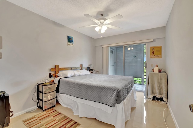 tiled bedroom featuring a textured ceiling and ceiling fan