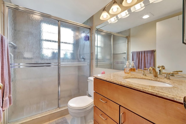 bathroom with tile patterned flooring, vanity, toilet, and an enclosed shower