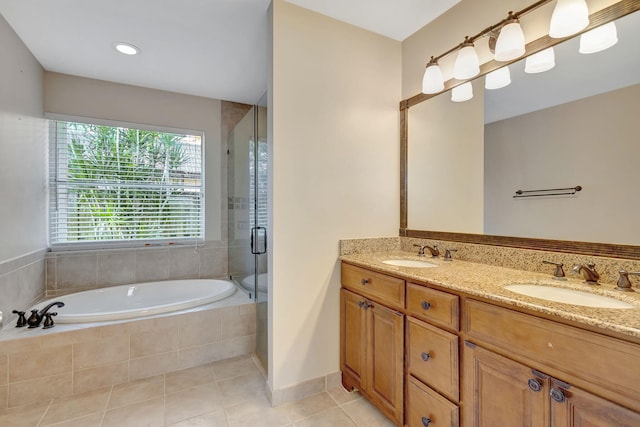 bathroom with tile patterned floors, vanity, and separate shower and tub