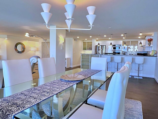 dining room with wood-type flooring