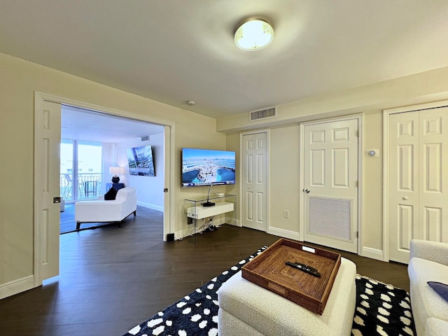 living room with dark wood-type flooring