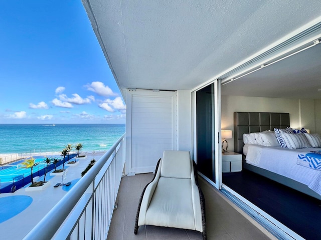 balcony with a view of the beach and a water view