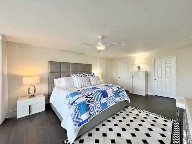 bedroom featuring dark hardwood / wood-style flooring and ceiling fan