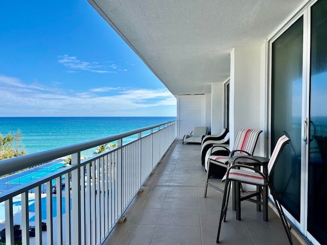 balcony featuring a water view