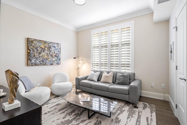 living room featuring hardwood / wood-style floors and crown molding