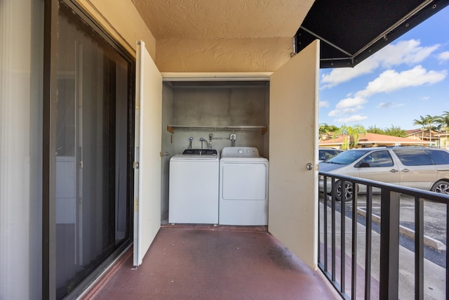 exterior space featuring washing machine and clothes dryer